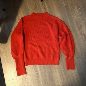 bright red knit sweater with cute sleeve detail